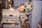 Dave Wilson, Bell & Howell arc 16MM projector, probably projecting "Bridge To The Future".